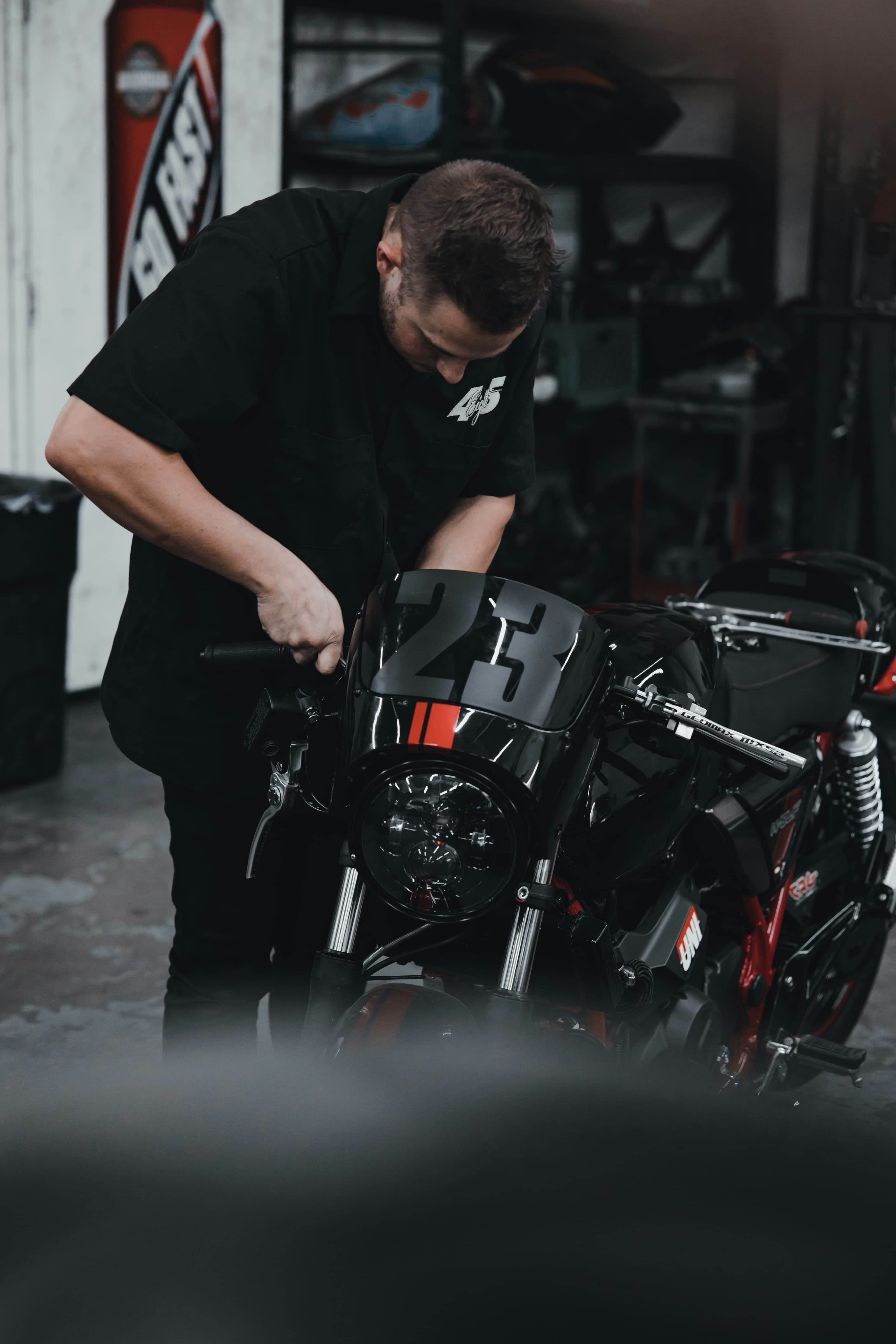Technician working on motorcycle